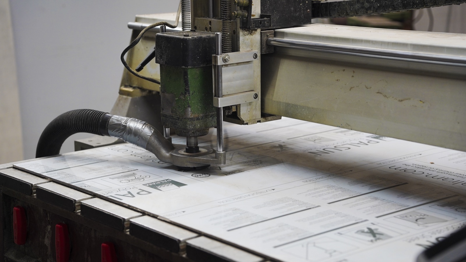 CNC router cutting sign materials with precision