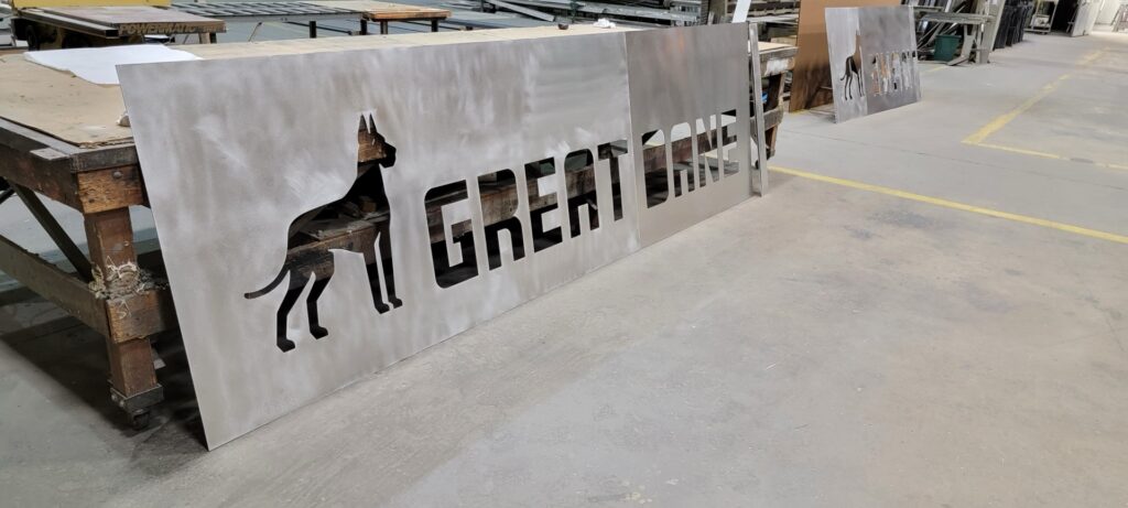 Large fabricated channel letters on pallets in the 21st Century Signs shop