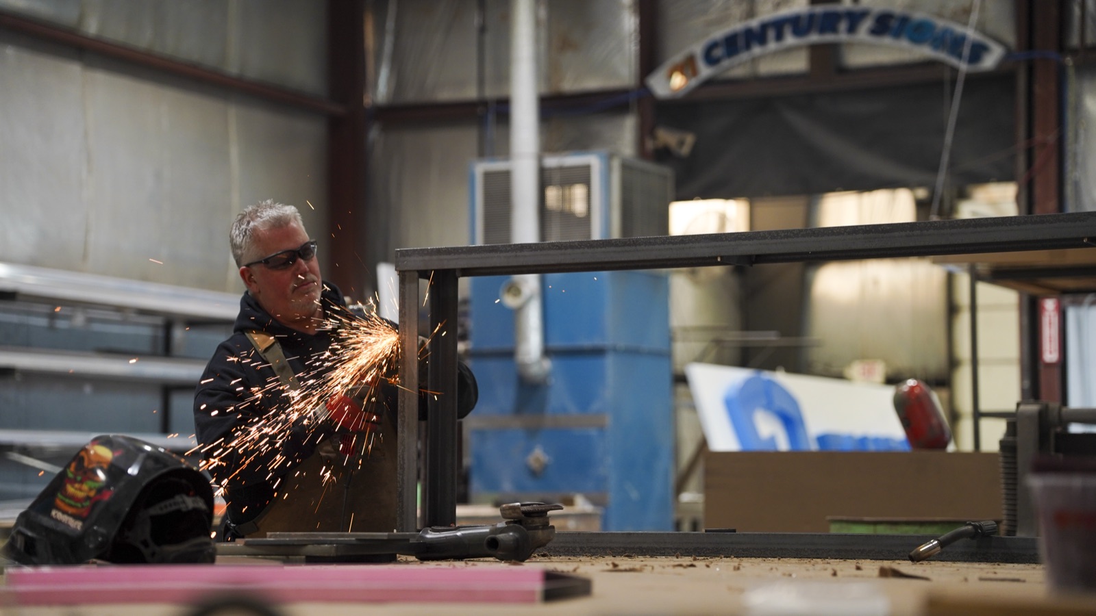 21st Century Signs shop floor with sparks flying