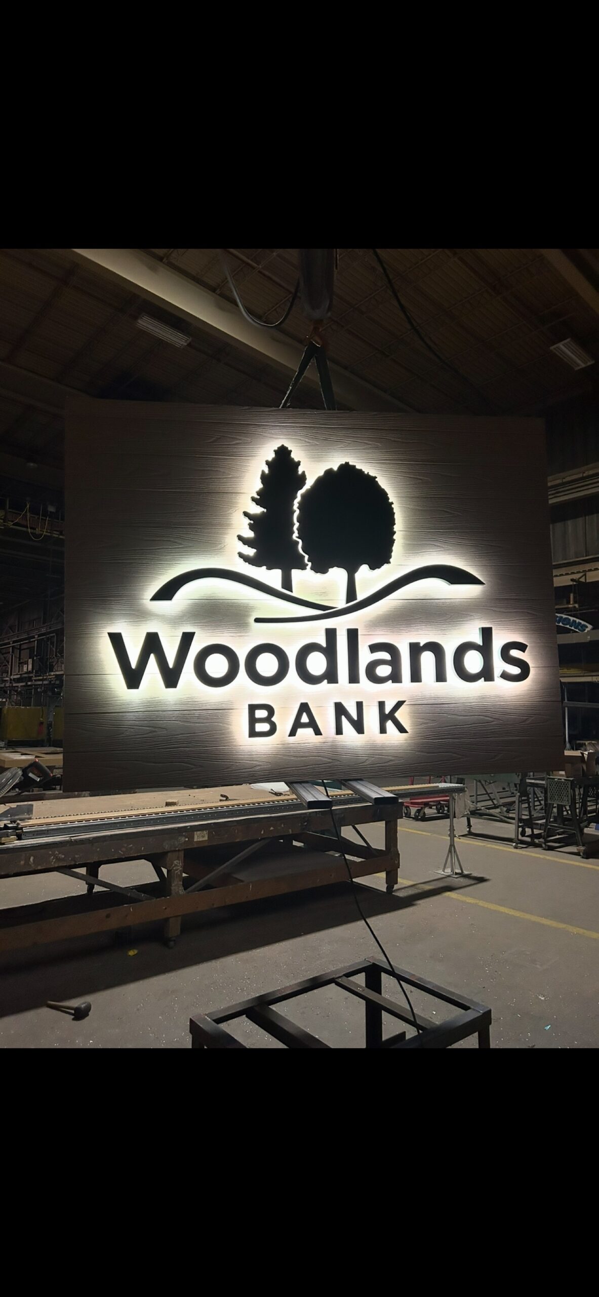 Backlit Woodlands Bank sign in the fabrication shop