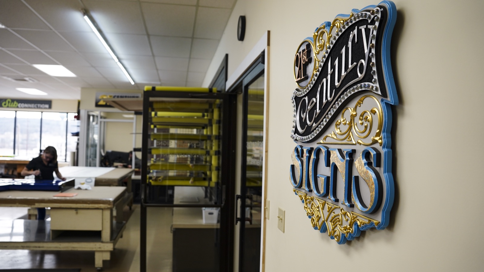 21st Century Signs dimensional logo crafted with gold leaf detail