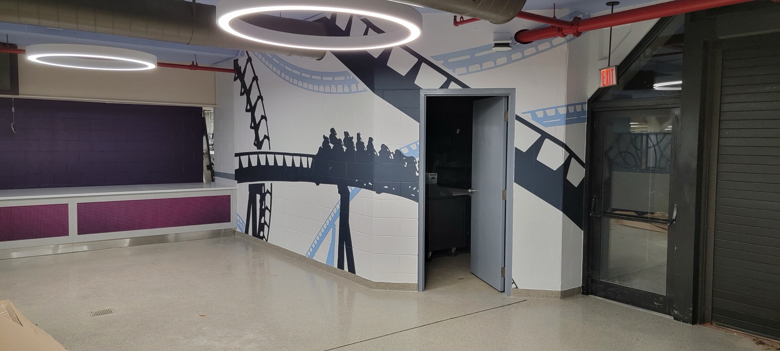 Custom roller coaster themed wall mural in a commercial space